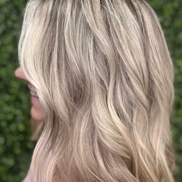 Cool toned ash blonde hair color after a brassy blonde correction at Moxi Hair Studio in McKinney, TX