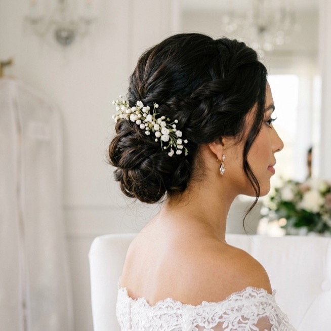Elegant bridal updo by a wedding hair stylist at Moxi Hair Studio in McKinney, TX