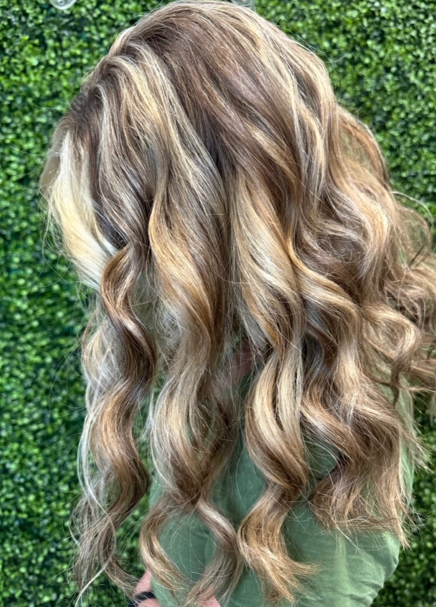 Brown hair with golden highlights and loose curls at Moxi Hair Studio, McKinney