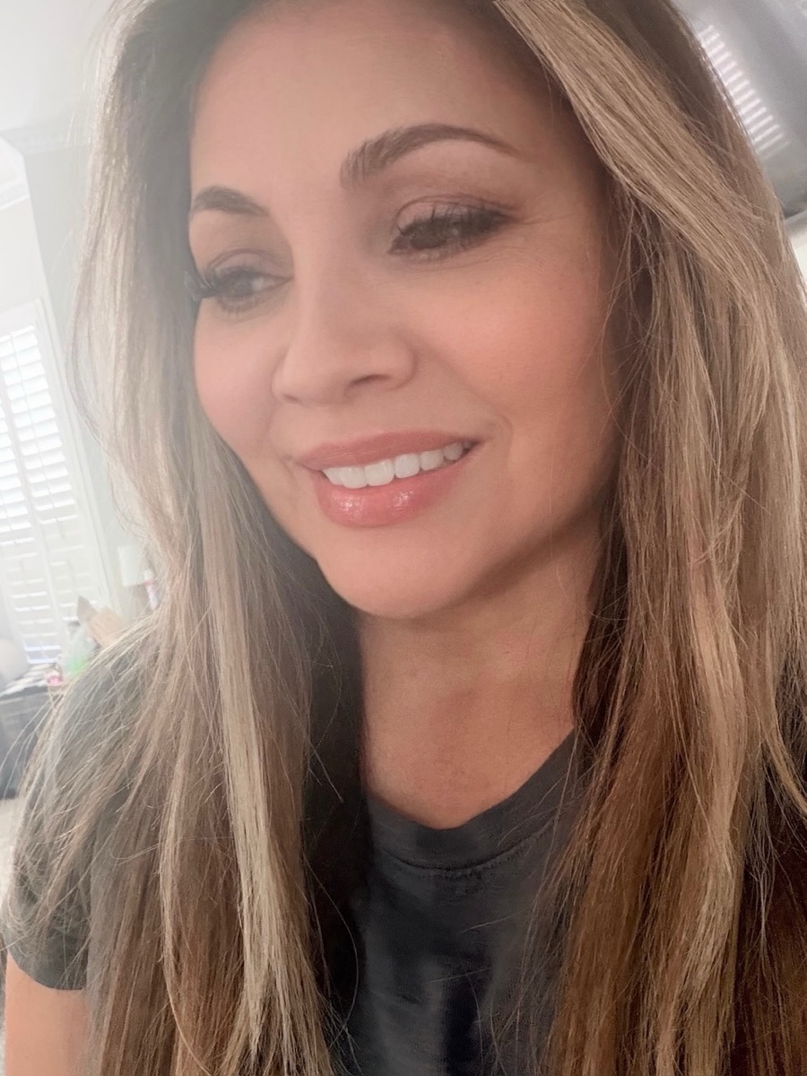 Honey blonde dimensional highlights with a straight blowout at a McKinney hair salon